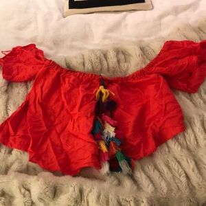 Red cold shoulder crop top with tassels